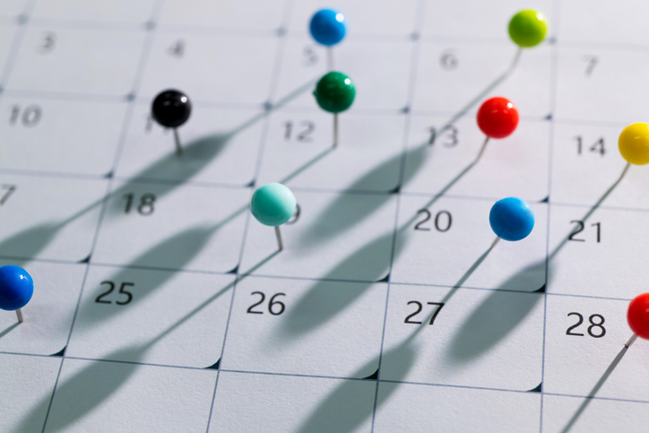 Colored pins on the calendar.